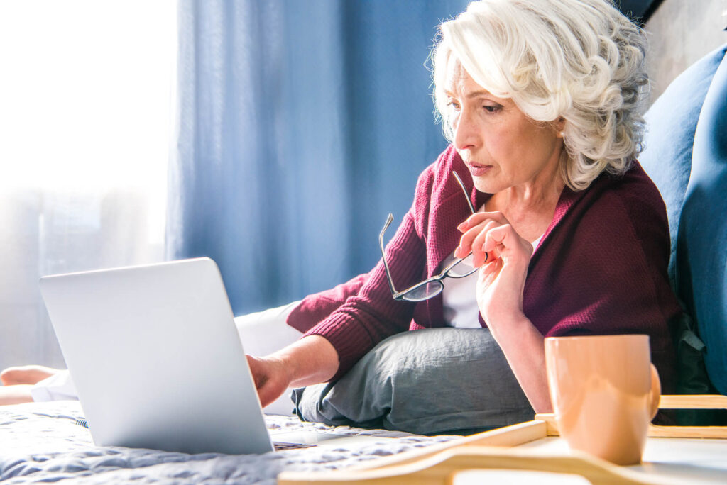 aged woman with laptop